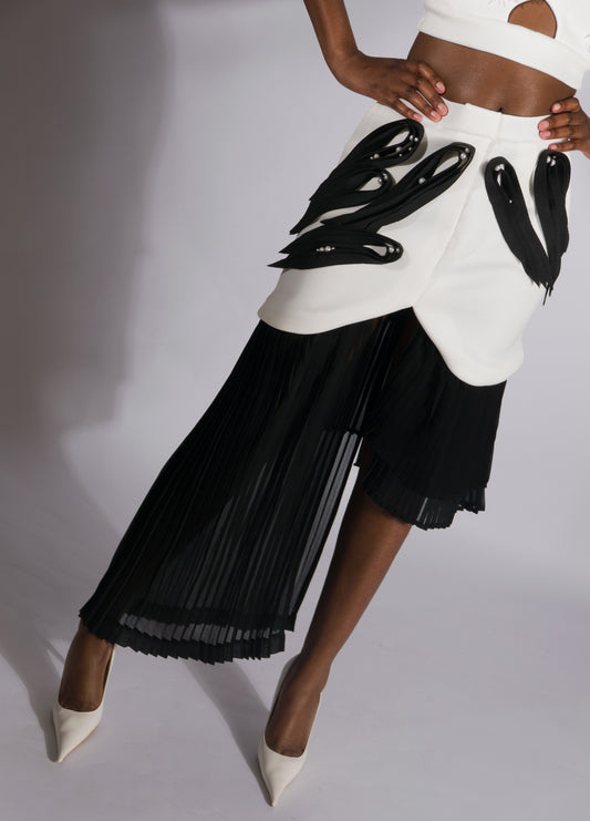 ARGO, asymmetrical pleated skirt with neoprene quilling-like application