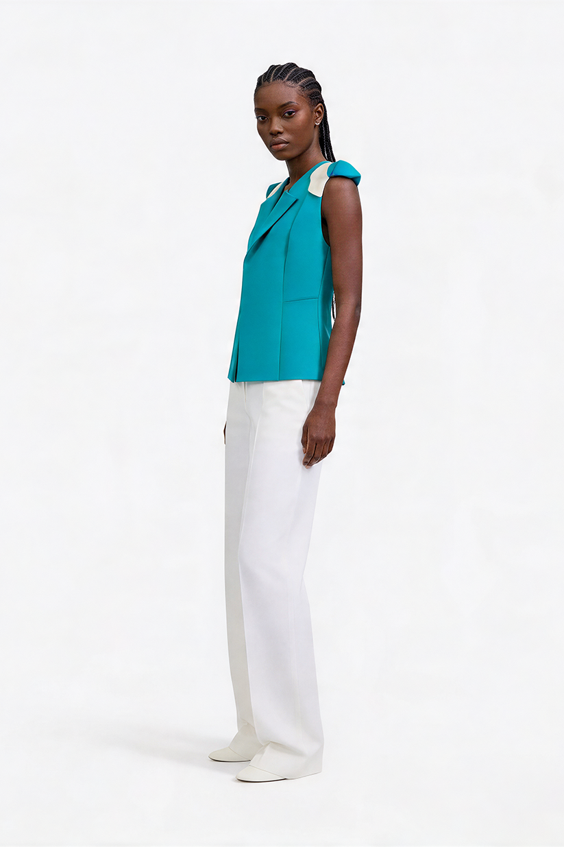 AVA, veste turquoise sans manches avec logo gravé